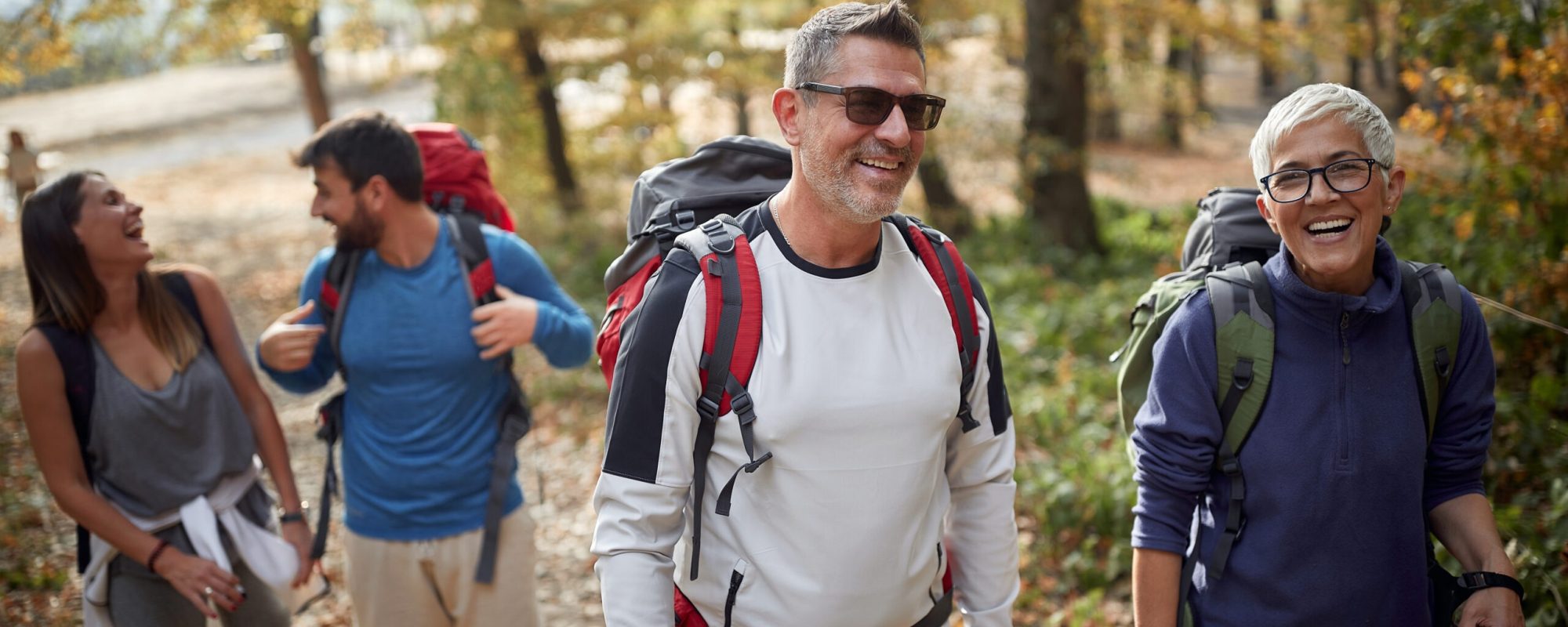Family trekking in the woods; Quality family time concept